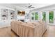 Spacious living room with fireplace, built-in bookshelves, and a comfortable sectional sofa at 4486 Huffman Drive Ne Dr, Roswell, GA 30075