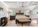 Main bedroom with fireplace, hardwood floors, and neutral decor at 4486 Huffman Drive Ne Dr, Roswell, GA 30075