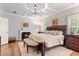 Spacious main bedroom with fireplace, sitting area, and coffered ceiling at 4486 Huffman Drive Ne Dr, Roswell, GA 30075