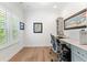 Bright office space with white walls, hardwood floors, large window with blinds, and a built-in desk with dual workstations at 4486 Huffman Drive Ne Dr, Roswell, GA 30075