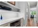Hallway desk nook with white shelves and countertop perfect for a home office at 4486 Huffman Drive Ne Dr, Roswell, GA 30075