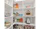 Well-organized walk-in pantry with custom shelving for ample storage at 4486 Huffman Drive Ne Dr, Roswell, GA 30075