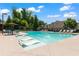 Community pool area with lounge chairs, umbrellas, and a relaxing atmosphere at 4486 Huffman Drive Ne Dr, Roswell, GA 30075