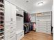 Well-organized walk-in closet with custom shelving, drawers, and hanging space, offering ample storage at 4486 Huffman Drive Ne Dr, Roswell, GA 30075