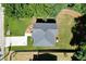 Aerial view of a well-maintained home with a new roof, vibrant lawn, and concrete driveway at 5350 Mercedes Dr, Cumming, GA 30041
