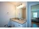 Well-lit bathroom with granite countertop and a view to the bedroom at 5350 Mercedes Dr, Cumming, GA 30041