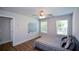 Comfortable bedroom with nice wood flooring, windows, and ceiling fan at 5350 Mercedes Dr, Cumming, GA 30041