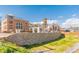 Cummings City Center showcases brick architecture, stone walls, and landscaped surroundings on a sunny day at 5350 Mercedes Dr, Cumming, GA 30041