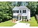 Charming two-story home features a landscaped front yard and classic black and white accents at 5350 Mercedes Dr, Cumming, GA 30041