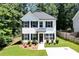 Charming two-story home features a landscaped front yard and classic black and white accents at 5350 Mercedes Dr, Cumming, GA 30041