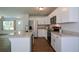 Spacious kitchen features granite countertops, stainless steel appliances, and an island at 5350 Mercedes Dr, Cumming, GA 30041