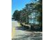 Sign for Tidwell Park with lake view, showcasing the local recreational area near the property at 5350 Mercedes Dr, Cumming, GA 30041