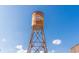 Cummings City Center water tower under a clear blue sky at 5350 Mercedes Dr, Cumming, GA 30041