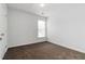 Carpeted bedroom with a window and a door to a closet at 1269 Gates Se Cir, Atlanta, GA 30316
