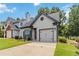Home featuring an attached one car garage, chimney, landscaped lawn and a well manicured garden at 1269 Gates Se Cir, Atlanta, GA 30316
