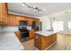 Well-lit kitchen features stainless steel appliances, wooden cabinets, and marble countertops at 1269 Gates Se Cir, Atlanta, GA 30316