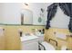 Bright bathroom with yellow tiling, functional fixtures, and a clean design at 2581 N Clark Dr, Atlanta, GA 30344