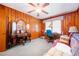 Cozy bedroom with paneled walls, desk, and vintage vanity area at 2581 N Clark Dr, Atlanta, GA 30344