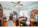 Bedroom with a four-poster bed, hardwood floors, and blue painted walls at 2581 N Clark Dr, Atlanta, GA 30344