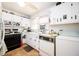 Efficient kitchen featuring white cabinets and essential appliances at 2581 N Clark Dr, Atlanta, GA 30344