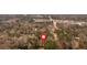 Overhead view shows the neighborhood's layout, highlighting streets, homes, and surrounding trees at 4138 Hickory Dr, Powder Springs, GA 30127