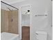 This bathroom features a shower stall with neutral paint, neutral tiling, and chrome fixtures at 4138 Hickory Dr, Powder Springs, GA 30127