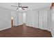 Cozy bedroom with modern flooring and access to a hallway, bathroom, and closets at 4138 Hickory Dr, Powder Springs, GA 30127