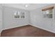 Bedroom with neutral colors, modern flooring, and dual windows at 4138 Hickory Dr, Powder Springs, GA 30127