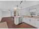 Open-concept kitchen showcasing granite countertops, a breakfast bar, and stainless steel appliances, perfect for entertaining at 4138 Hickory Dr, Powder Springs, GA 30127