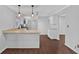 Well-appointed kitchen featuring granite countertops, white cabinets, and stylish pendant lighting at 4138 Hickory Dr, Powder Springs, GA 30127