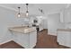 Stylish kitchen with granite countertops, modern pendant lighting, and updated appliances for culinary enthusiasts at 4138 Hickory Dr, Powder Springs, GA 30127