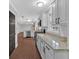 Modern kitchen with granite countertops, stainless steel appliances, and ample cabinet space open to the living area at 4138 Hickory Dr, Powder Springs, GA 30127