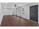 Spacious living room boasts gleaming hardwood floors, abundant natural light and a modern ceiling fan at 4138 Hickory Dr, Powder Springs, GA 30127