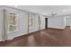 Bright living room with hardwood floors, neutral walls and multiple windows providing plenty of sunlight at 4138 Hickory Dr, Powder Springs, GA 30127