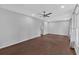 Bright living room featuring wood floors, neutral paint, a ceiling fan, and natural light at 4138 Hickory Dr, Powder Springs, GA 30127