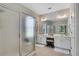 Bright Primary bathroom featuring dual vanities, a glass-enclosed shower, and tile flooring at 4140 Prince Charles Dr, Duluth, GA 30097