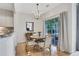 Cozy dining area with hardwood floors and natural light, perfect for entertaining and relaxation at 4140 Prince Charles Dr, Duluth, GA 30097