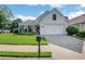 Charming single-story home with manicured lawn and attached two-car garage on a sunny day at 4140 Prince Charles Dr, Duluth, GA 30097
