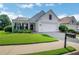 Charming single-story home with manicured lawn and attached two-car garage on a sunny day at 4140 Prince Charles Dr, Duluth, GA 30097