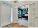 Bright foyer with hardwood floors, glass door access to an office space with view of chandelier at 4140 Prince Charles Dr, Duluth, GA 30097