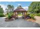 Charming gazebo with benches nestled among trees, inviting relaxation and serenity at 4140 Prince Charles Dr, Duluth, GA 30097