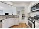Modern kitchen with stainless steel appliances, granite countertops, and an open design to the living spaces at 4140 Prince Charles Dr, Duluth, GA 30097