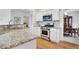 Well-equipped kitchen featuring stainless steel appliances, granite countertops, and ample cabinet space at 4140 Prince Charles Dr, Duluth, GA 30097