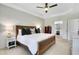Spacious main bedroom offering ample natural light, tray ceiling, and access to the ensuite bathroom at 4140 Prince Charles Dr, Duluth, GA 30097