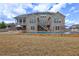 Backyard with a stone-edged pool and spacious patio area, perfect for outdoor entertaining at 5540 Wood Falls Dr, Buford, GA 30518