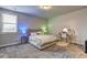 Bedroom featuring a bed, desk, and a window with natural light at 5540 Wood Falls Dr, Buford, GA 30518