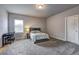 Cozy bedroom with carpet flooring, desk, and a comfortable bed at 5540 Wood Falls Dr, Buford, GA 30518