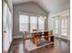 Dining room with hardwood floors and large windows providing natural light at 5540 Wood Falls Dr, Buford, GA 30518