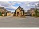 Charming stone gatehouse leading to a secure, gated community at 5540 Wood Falls Dr, Buford, GA 30518