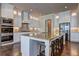Modern kitchen featuring white cabinets, stainless steel appliances, and a large center island at 5540 Wood Falls Dr, Buford, GA 30518